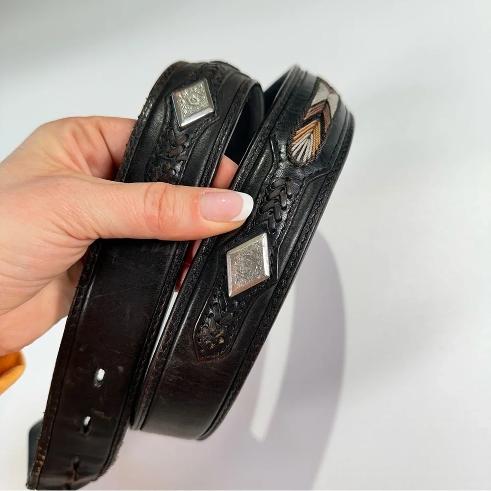 Black Leather Belt with Intricate Silver Buckle